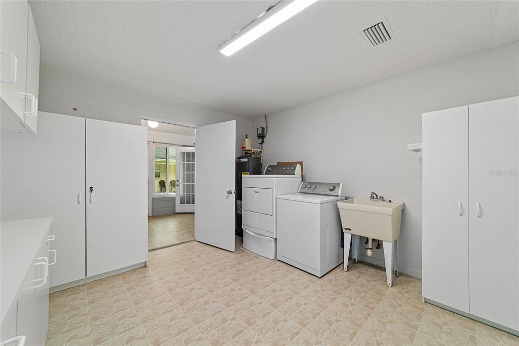 8678 Southwest 95 Street, Unit D Ocala, FL 34481 - Photo 31 of 36 a view of a room with washing machine