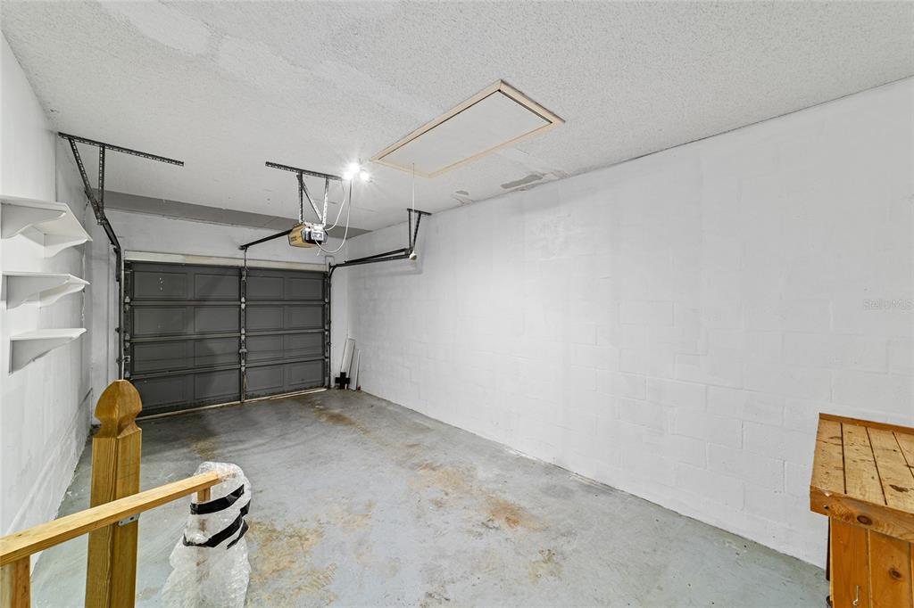 8678 Southwest 95 Street, Unit D Ocala, FL 34481 - Photo 32 of 36 a view of a garage