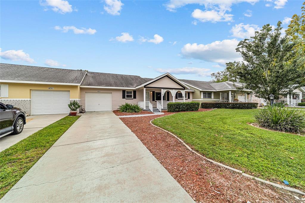 8678 Southwest 95 Street, Unit D Ocala, FL 34481 - Photo 34 of 36 a view of house with yard