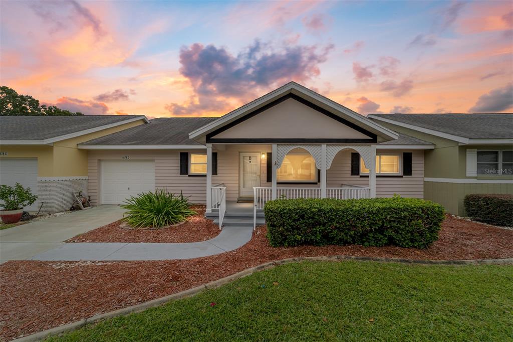 8678 Southwest 95 Street, Unit D Ocala, FL 34481 - Photo 36 of 36 front view of a house with a yard