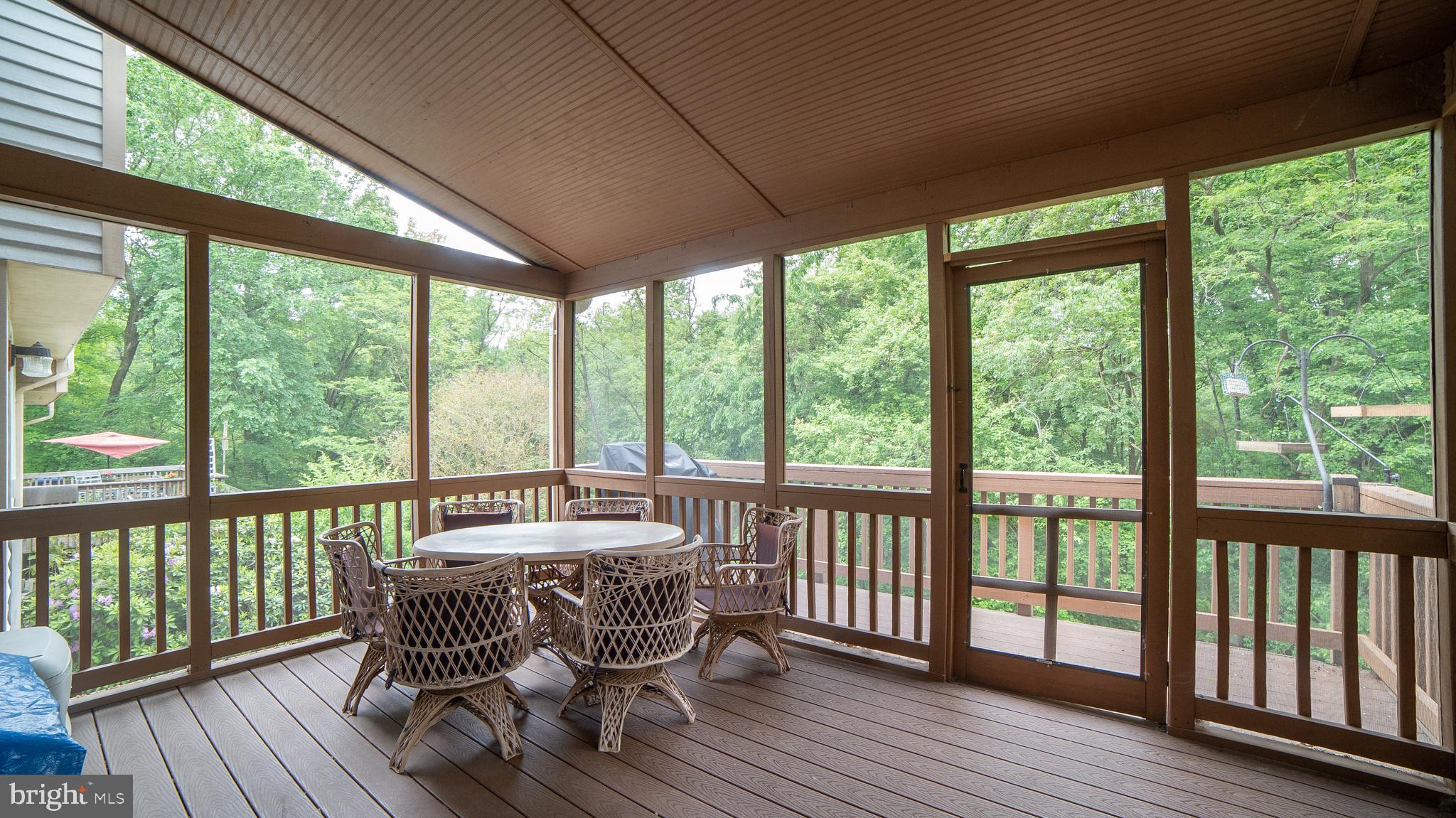 10544 Apple Ridge Road Gaithersburg, MD 20886 - Photo 11 of 24 Screened trex deck looks out over nature preserve
