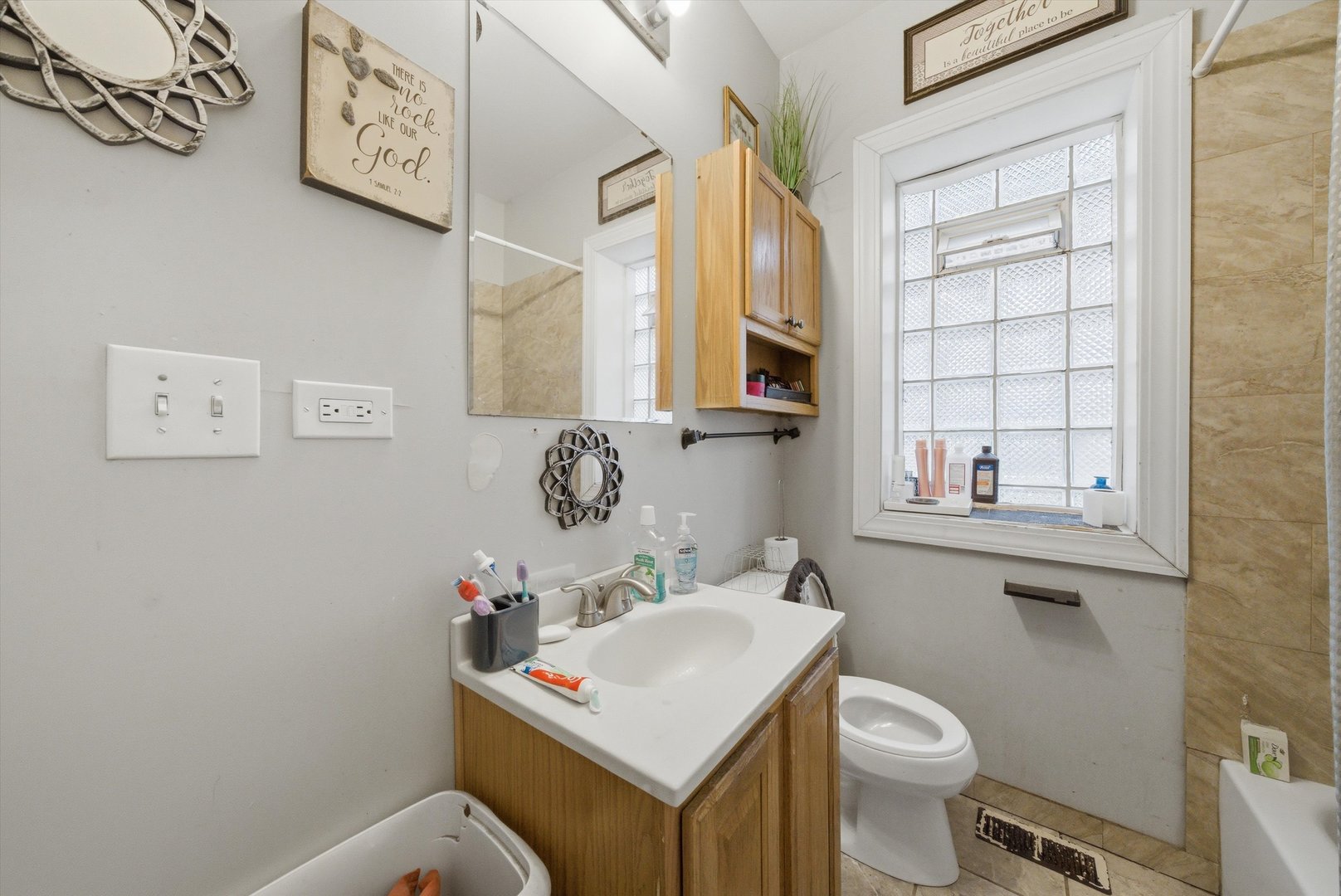 6837 South Morgan Street Chicago, IL 60621 - Photo 16 of 24 a bathroom with a toilet sink and mirror