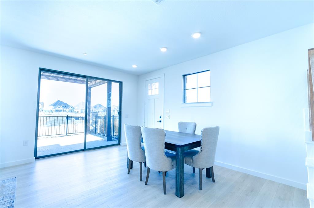 1248 Armstrong The Colony, TX 75056 - Photo 10 of 25 a view of a dining room with furniture and wooden floor