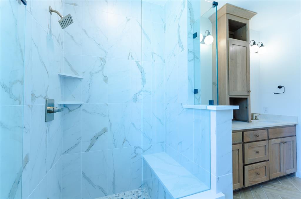 1248 Armstrong The Colony, TX 75056 - Photo 11 of 25 a bathroom with a sink and a mirror
