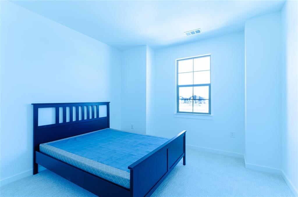 1248 Armstrong The Colony, TX 75056 - Photo 16 of 25 a bedroom with a bed and a window