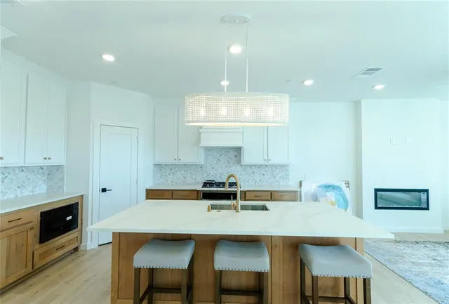 a kitchen with a table and chairs in it