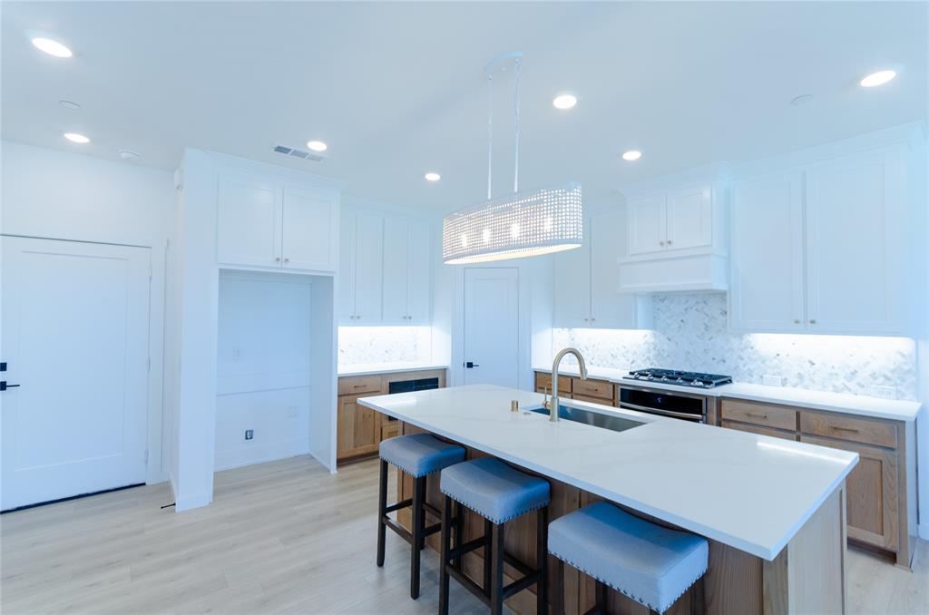 1248 Armstrong The Colony, TX 75056 - Photo 5 of 25 a kitchen with a table and chairs in it