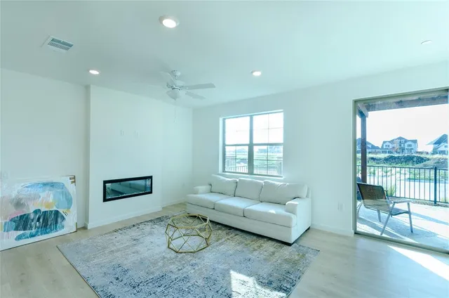 a living room with furniture and a stove