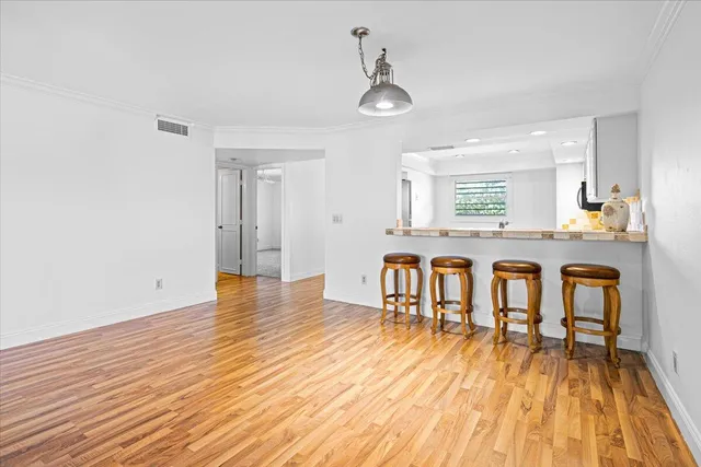 a view of a kitchen with granite countertop wooden floor and a sink