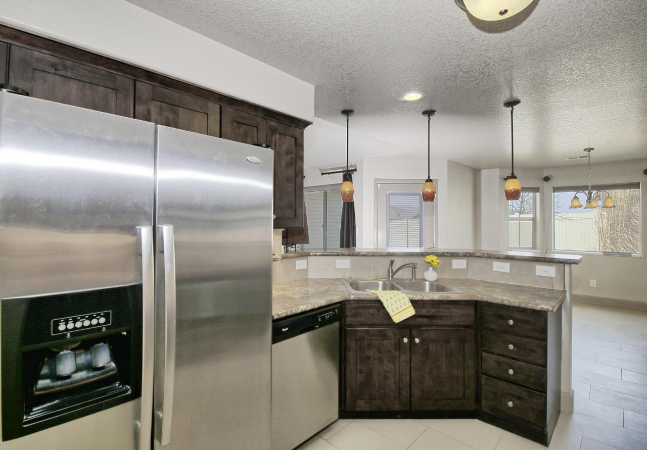 199 Red Rocks Street Fruita, CO 81521 - Photo 11 of 25 a bathroom with a granite countertop sink a toilet and shower