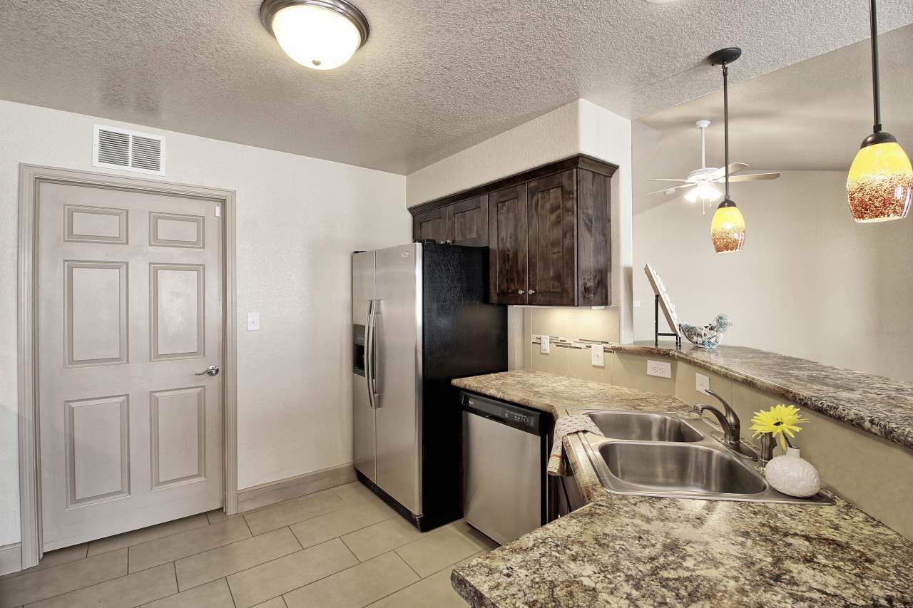 199 Red Rocks Street Fruita, CO 81521 - Photo 12 of 25 a kitchen with a sink a counter space and stainless steel appliances