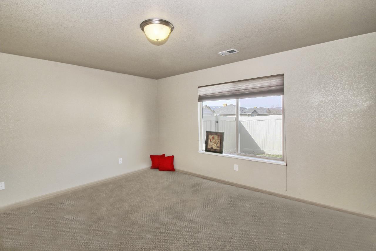 199 Red Rocks Street Fruita, CO 81521 - Photo 18 of 25 an empty room with a window