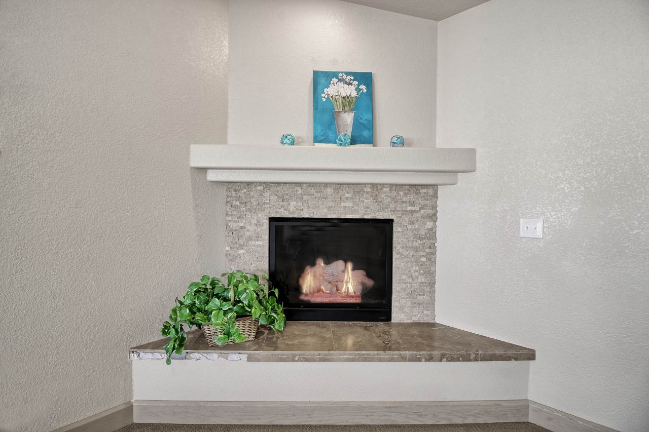 199 Red Rocks Street Fruita, CO 81521 - Photo 5 of 25 a living room with a fireplace