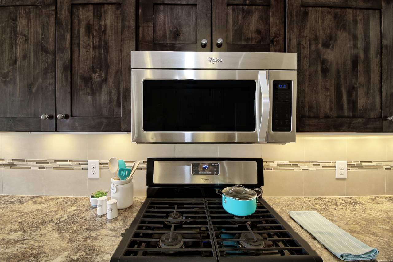 199 Red Rocks Street Fruita, CO 81521 - Photo 9 of 25 a kitchen with a stove and a microwave