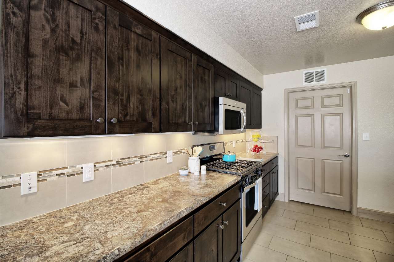 199 Red Rocks Street Fruita, CO 81521 - Photo 10 of 25 a kitchen with a sink and a stove top oven
