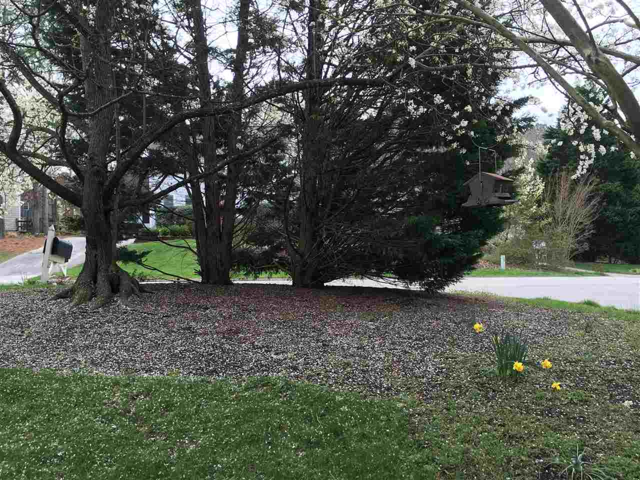 2 Hitching Rack Court Durham, NC 27713 - Photo 23 of 23 Landscaped frontyard has tree perimeter and mulched beds. Front Yard