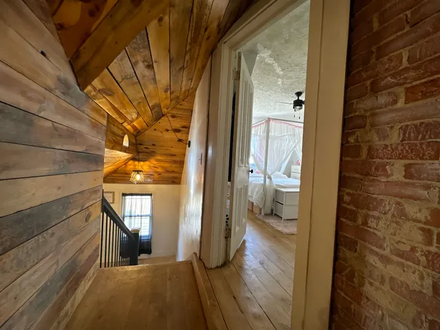 a bedroom with a bed a desk and chair