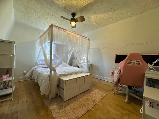a bedroom with a bed and cabinets
