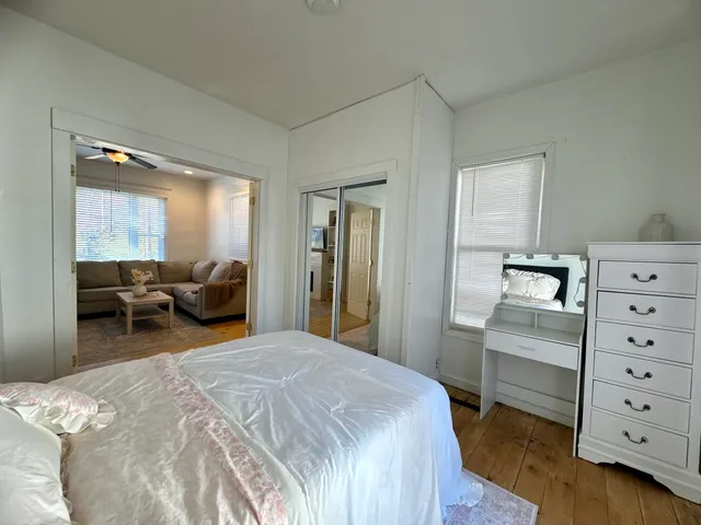 a bedroom with a bed and furniture