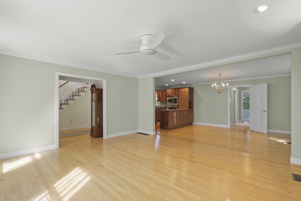 2 Tricia Road Falmouth, MA 02556 - Photo 11 of 39 a view of an empty room with wooden floor and a ceiling fan