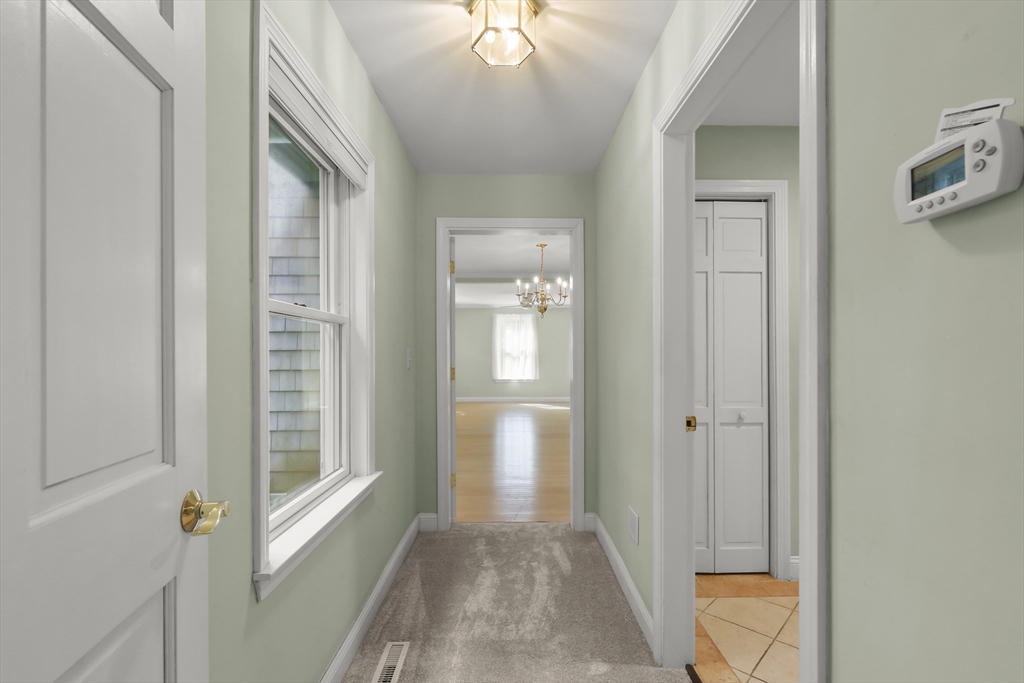 2 Tricia Road Falmouth, MA 02556 - Photo 13 of 39 a view of a hallway with windows and entryway