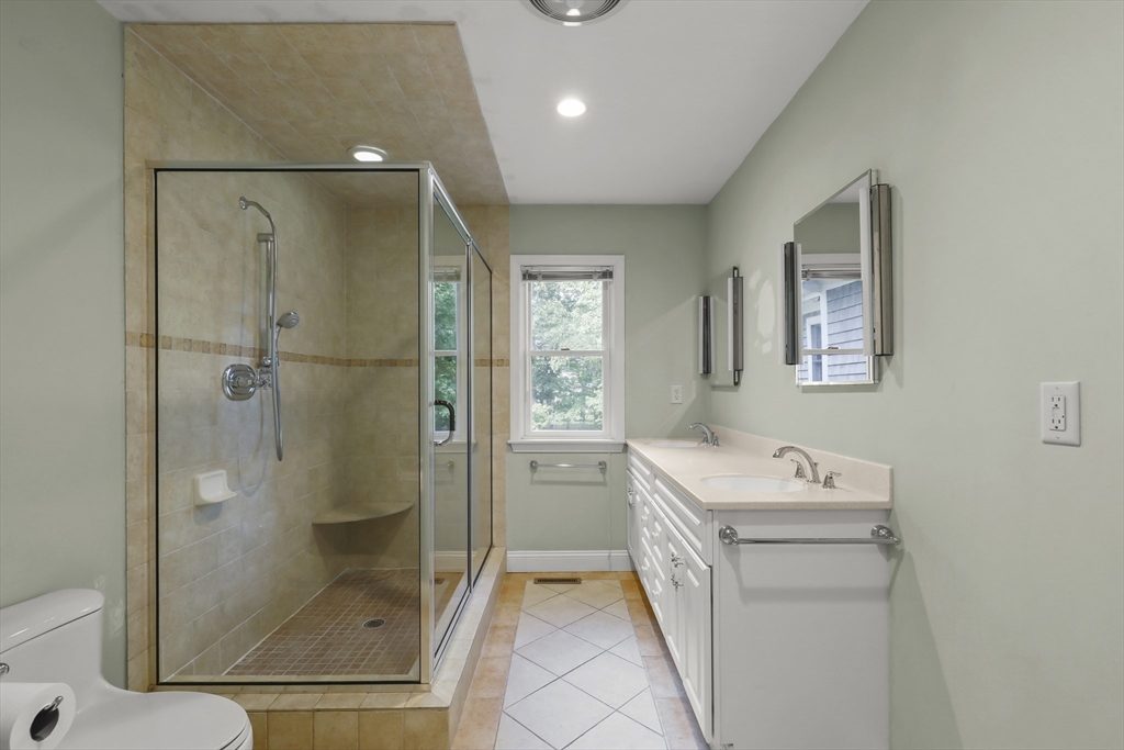 2 Tricia Road Falmouth, MA 02556 - Photo 15 of 39 a bathroom with a sink a toilet and shower