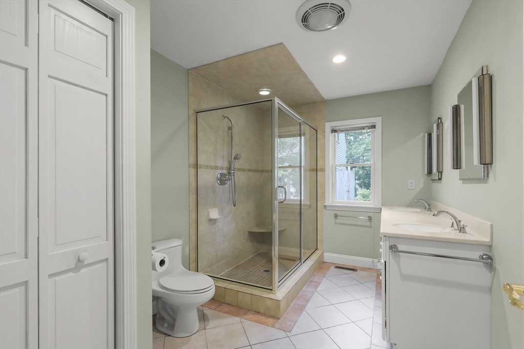 2 Tricia Road Falmouth, MA 02556 - Photo 16 of 39 a bathroom with a granite countertop sink a toilet and shower