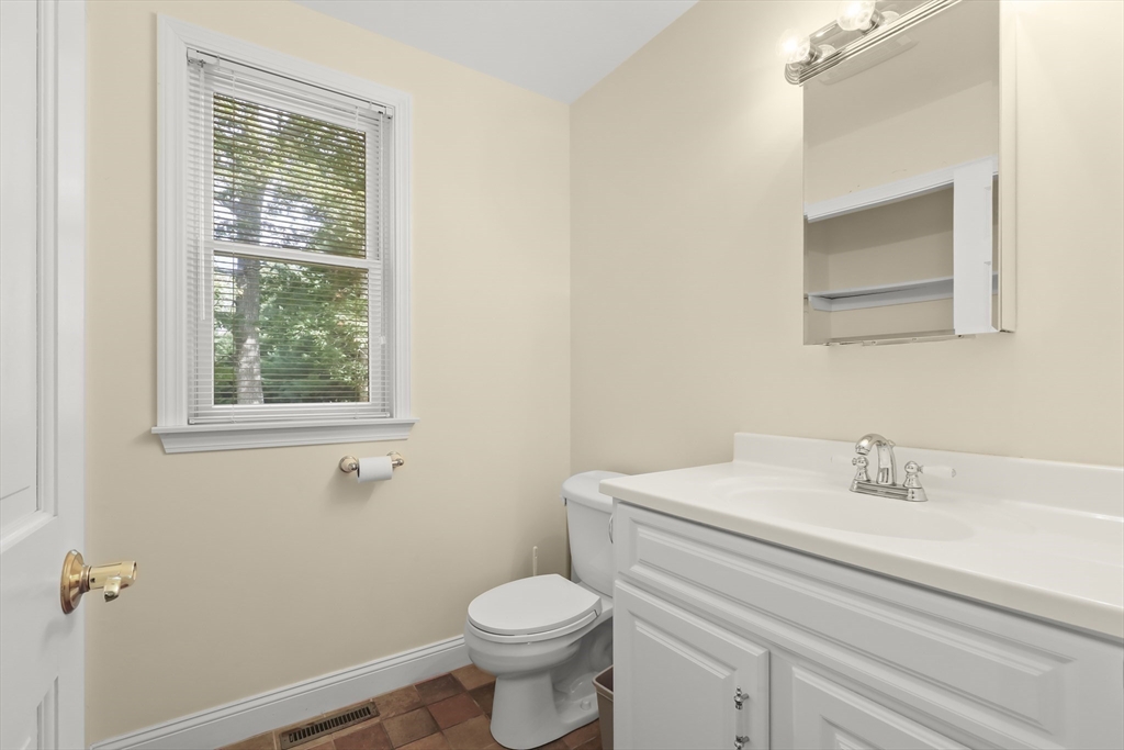 2 Tricia Road Falmouth, MA 02556 - Photo 21 of 39 a bathroom with a sink mirror and toilet
