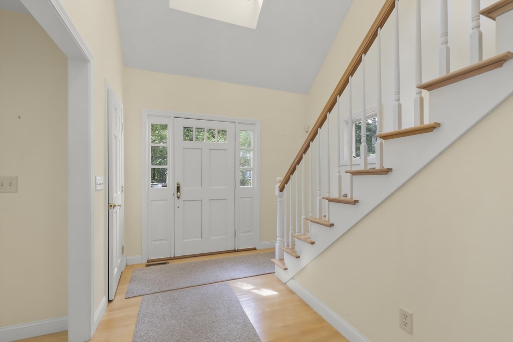 2 Tricia Road Falmouth, MA 02556 - Photo 24 of 39 a view of staircase with lots of frames and white walls