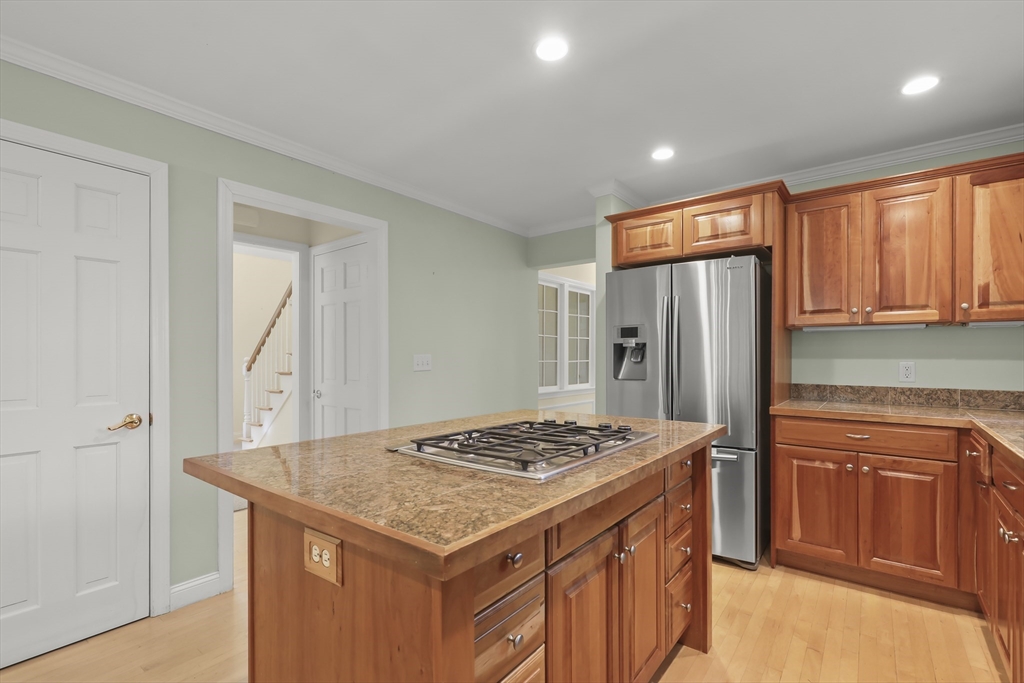 2 Tricia Road Falmouth, MA 02556 - Photo 3 of 39 a kitchen that has a kitchen island wooden cabinets and refrigerator