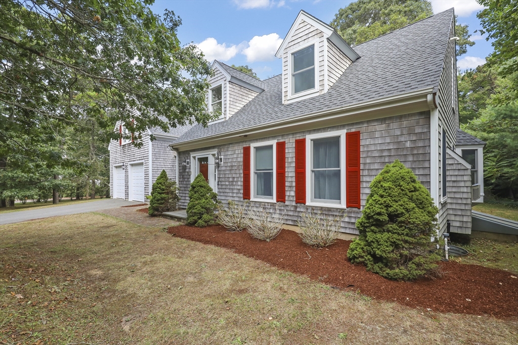 2 Tricia Road Falmouth, MA 02556 - Photo 36 of 39 a front view of a house with garden