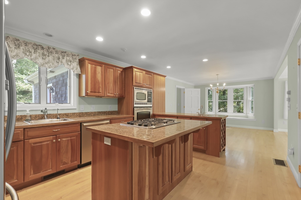 2 Tricia Road Falmouth, MA 02556 - Photo 6 of 39 a kitchen with a stove a sink a refrigerator and wooden cabinets