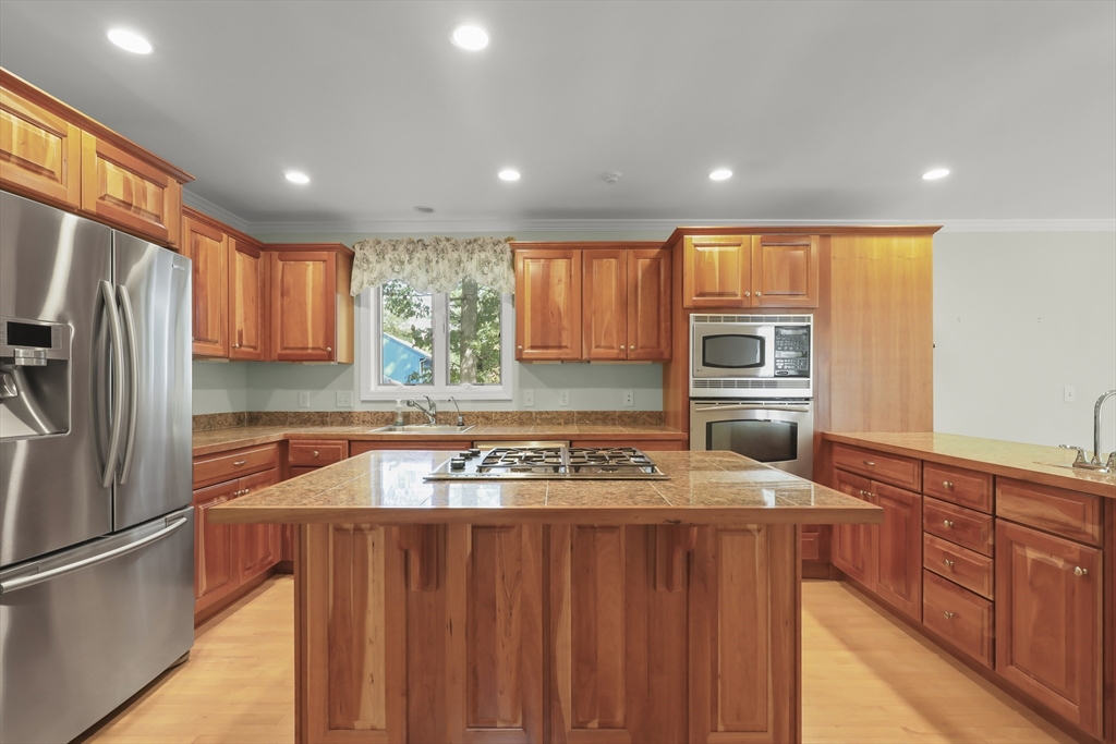 2 Tricia Road Falmouth, MA 02556 - Photo 7 of 39 a kitchen with a stove a refrigerator and a sink