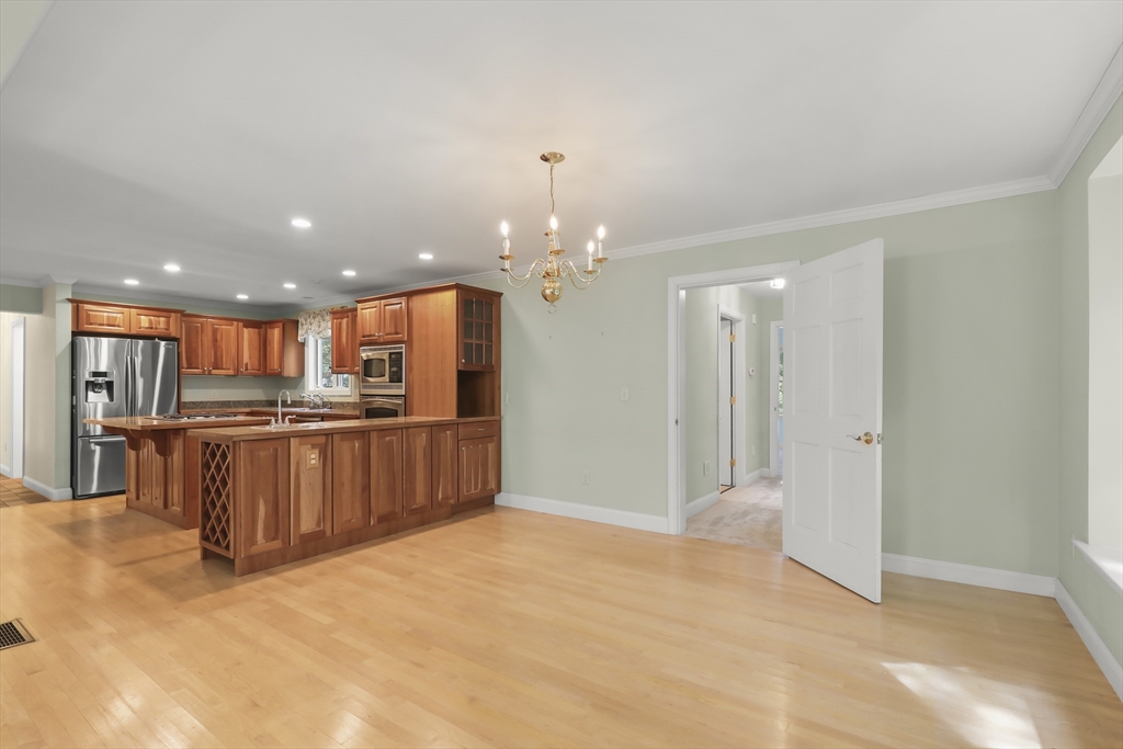 2 Tricia Road Falmouth, MA 02556 - Photo 8 of 39 a open kitchen with kitchen island a refrigerator and a sink