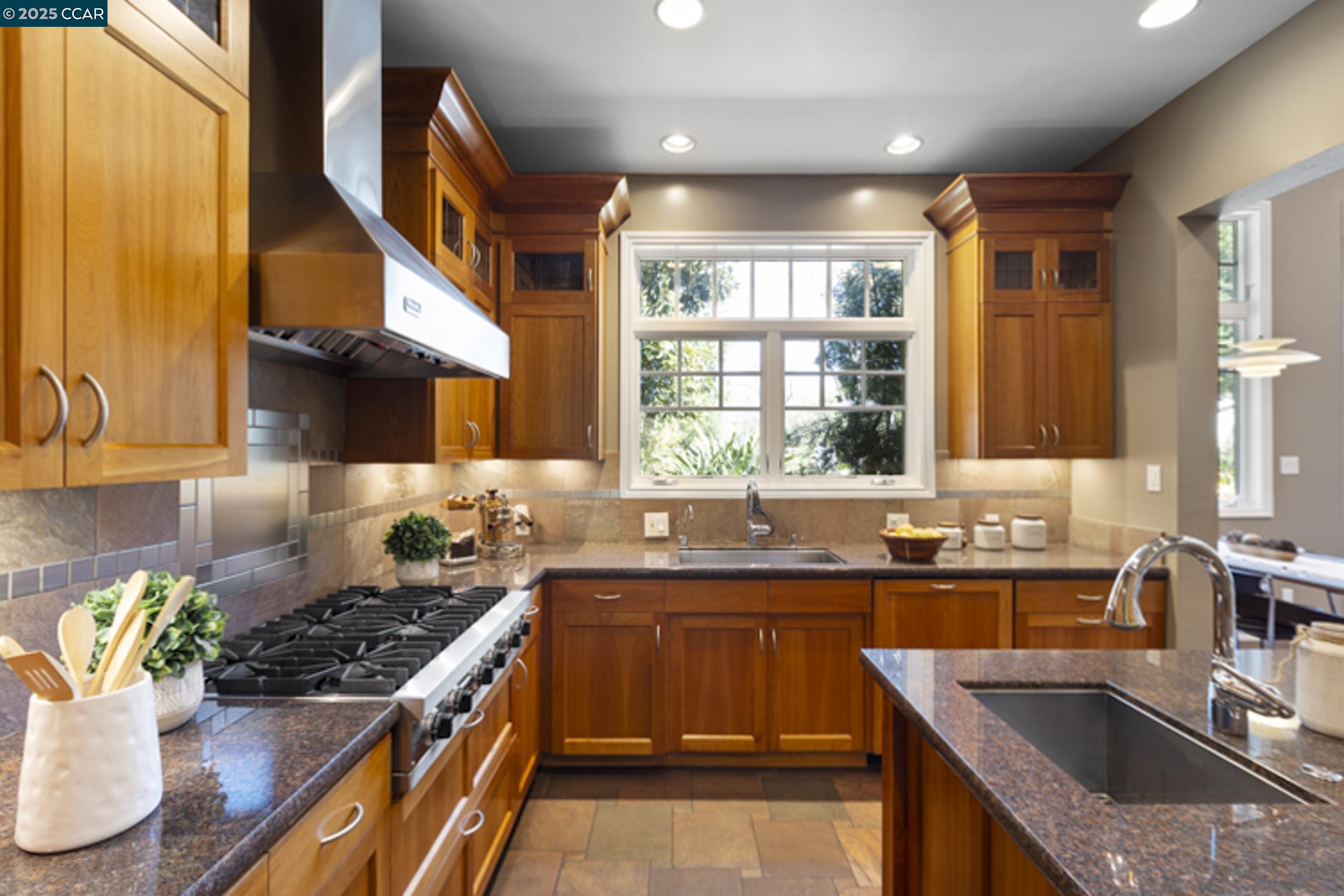 350 Pine Creek Road Walnut Creek, CA 94598 - Photo 11 of 59 a kitchen with a sink stove and cabinets