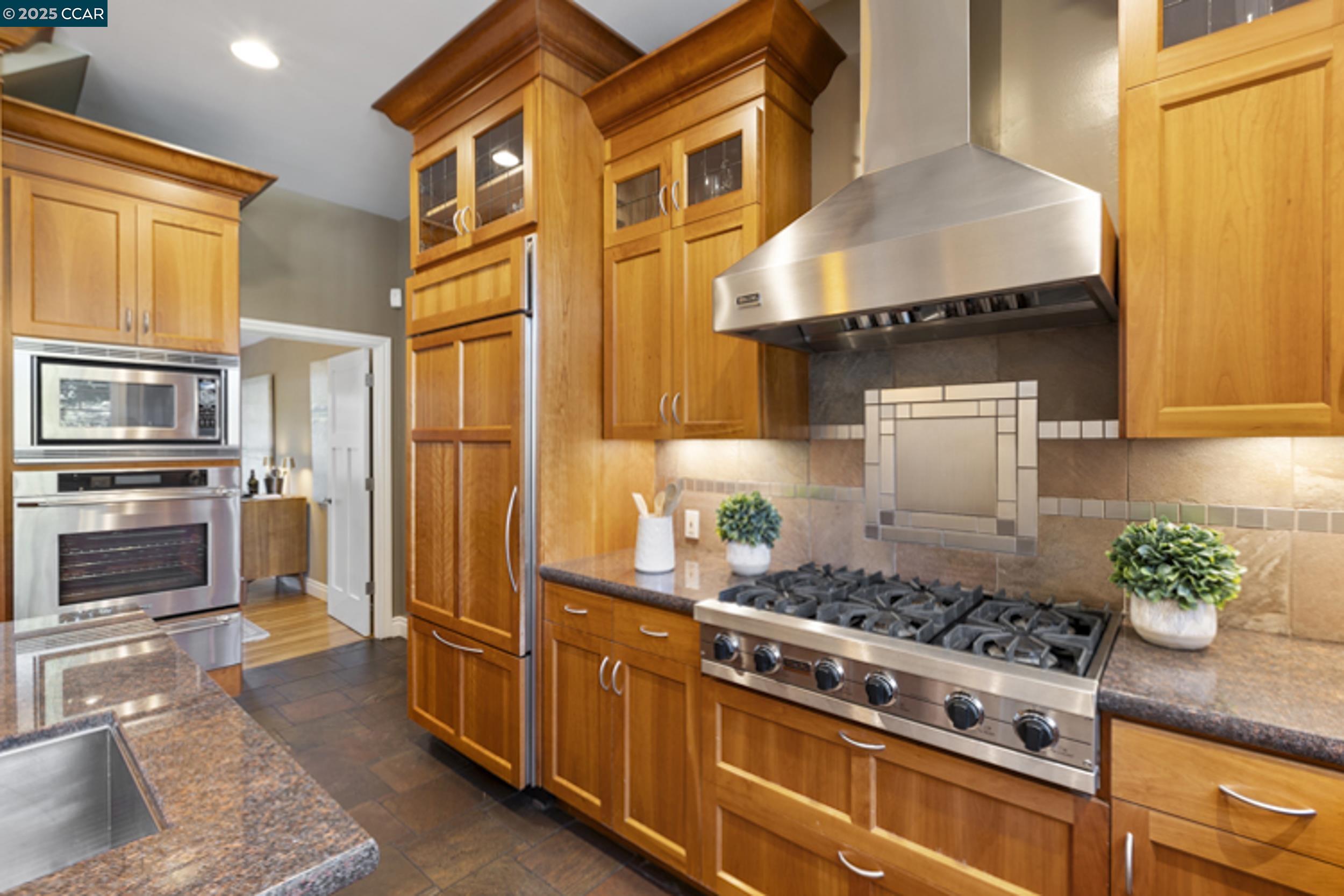 350 Pine Creek Road Walnut Creek, CA 94598 - Photo 12 of 59 a kitchen with stainless steel appliances granite countertop a stove and a refrigerator