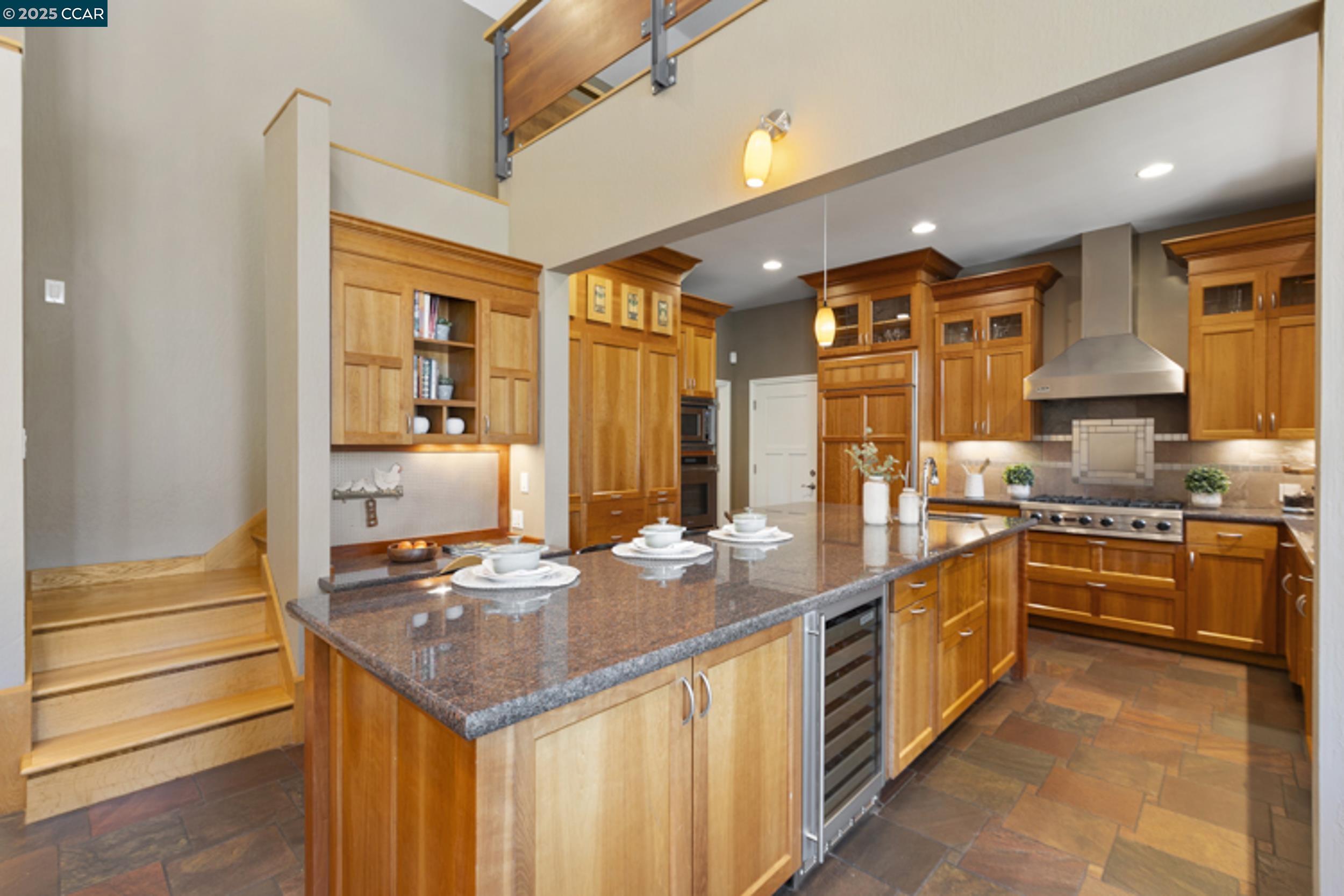 350 Pine Creek Road Walnut Creek, CA 94598 - Photo 13 of 59 a kitchen with stainless steel appliances kitchen island granite countertop a sink and cabinets