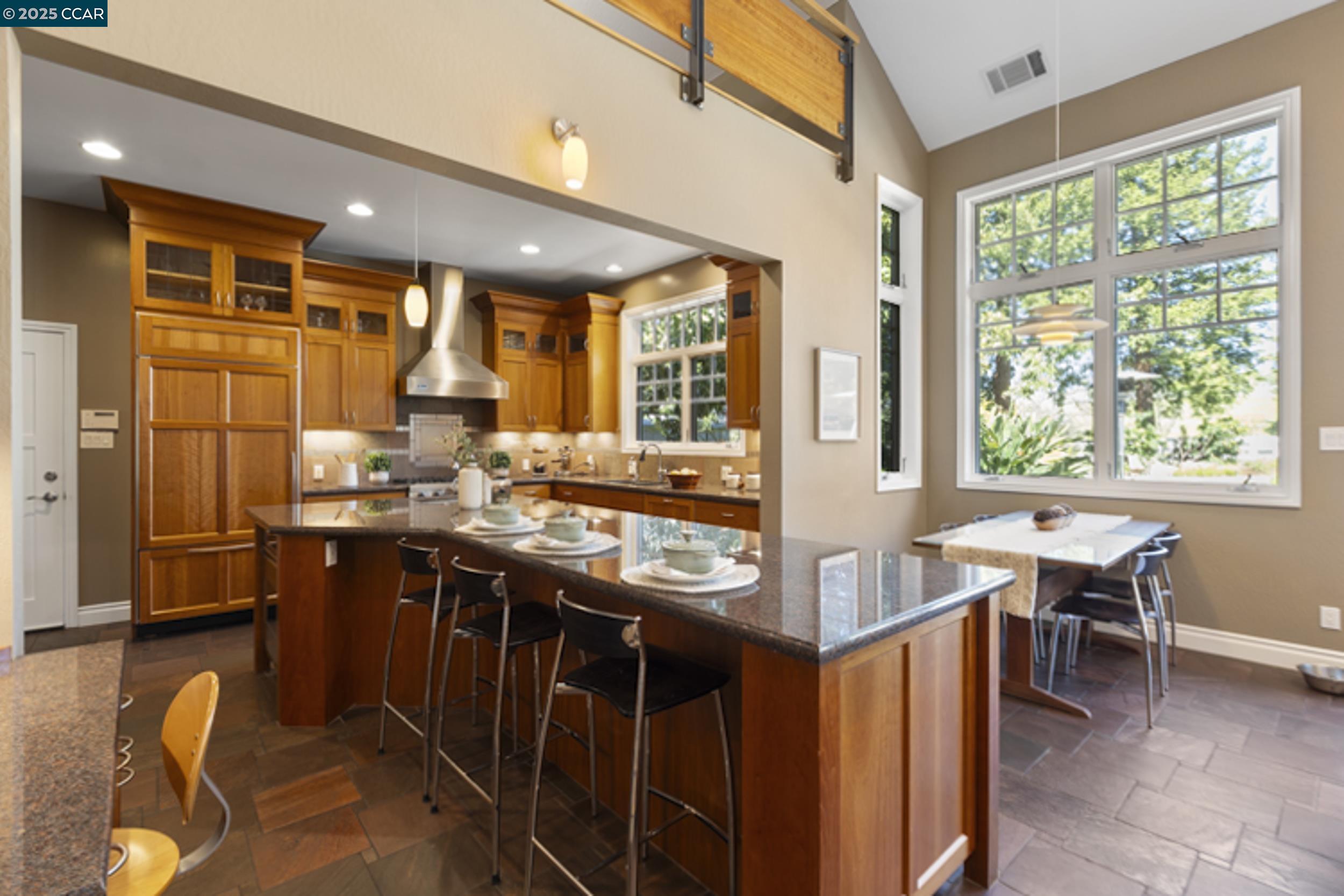 350 Pine Creek Road Walnut Creek, CA 94598 - Photo 15 of 59 a kitchen with stainless steel appliances granite countertop sink stove and wooden cabinets