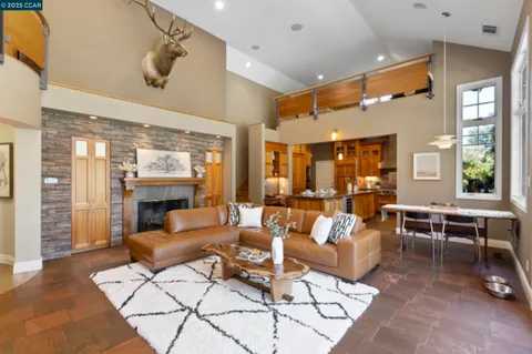 a living room with furniture and a table