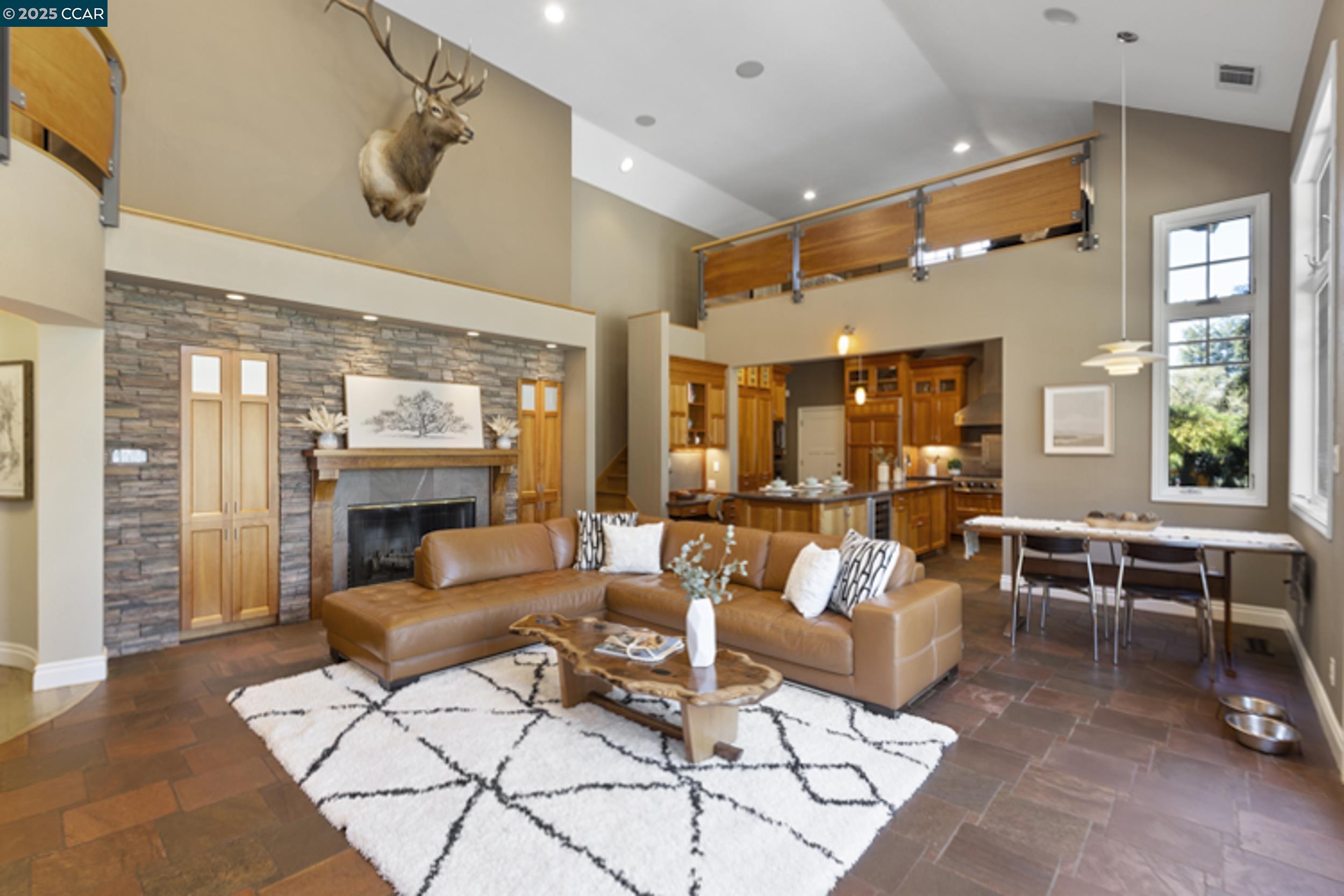 350 Pine Creek Road Walnut Creek, CA 94598 - Photo 17 of 59 a living room with furniture and a fireplace