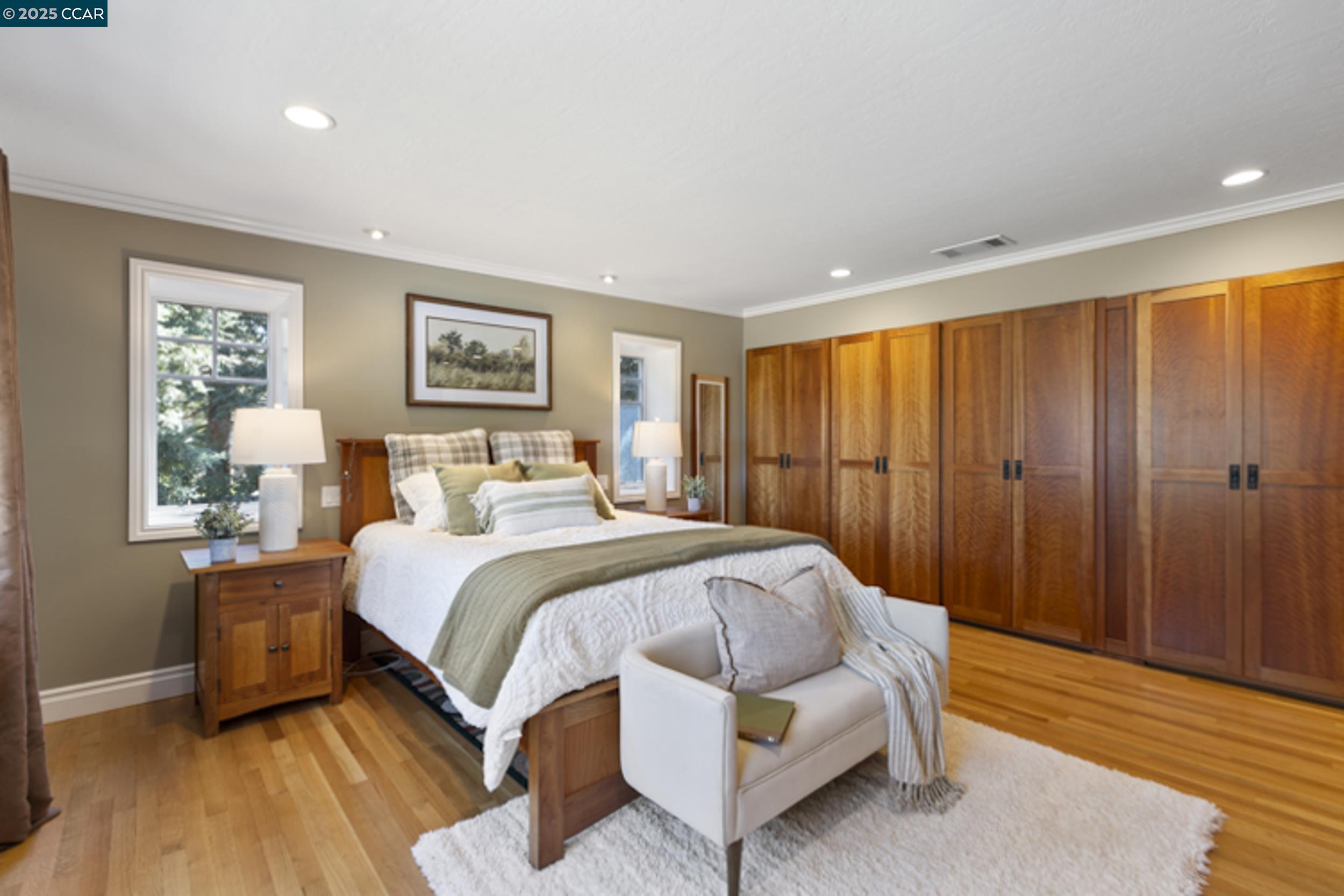 350 Pine Creek Road Walnut Creek, CA 94598 - Photo 24 of 59 a bedroom with a bed lamp and a large window