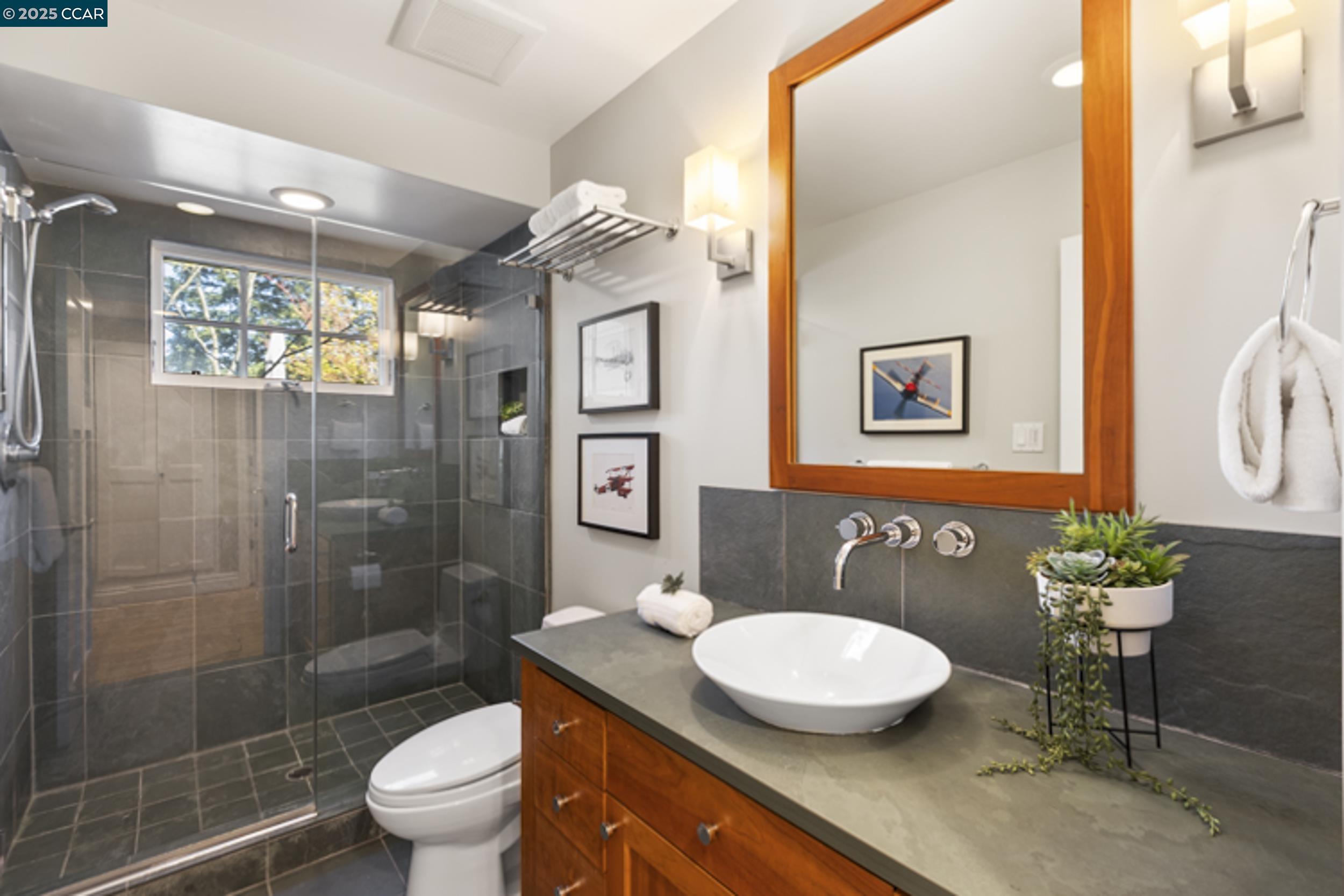 350 Pine Creek Road Walnut Creek, CA 94598 - Photo 30 of 59 a bathroom with a granite countertop sink a toilet and shower