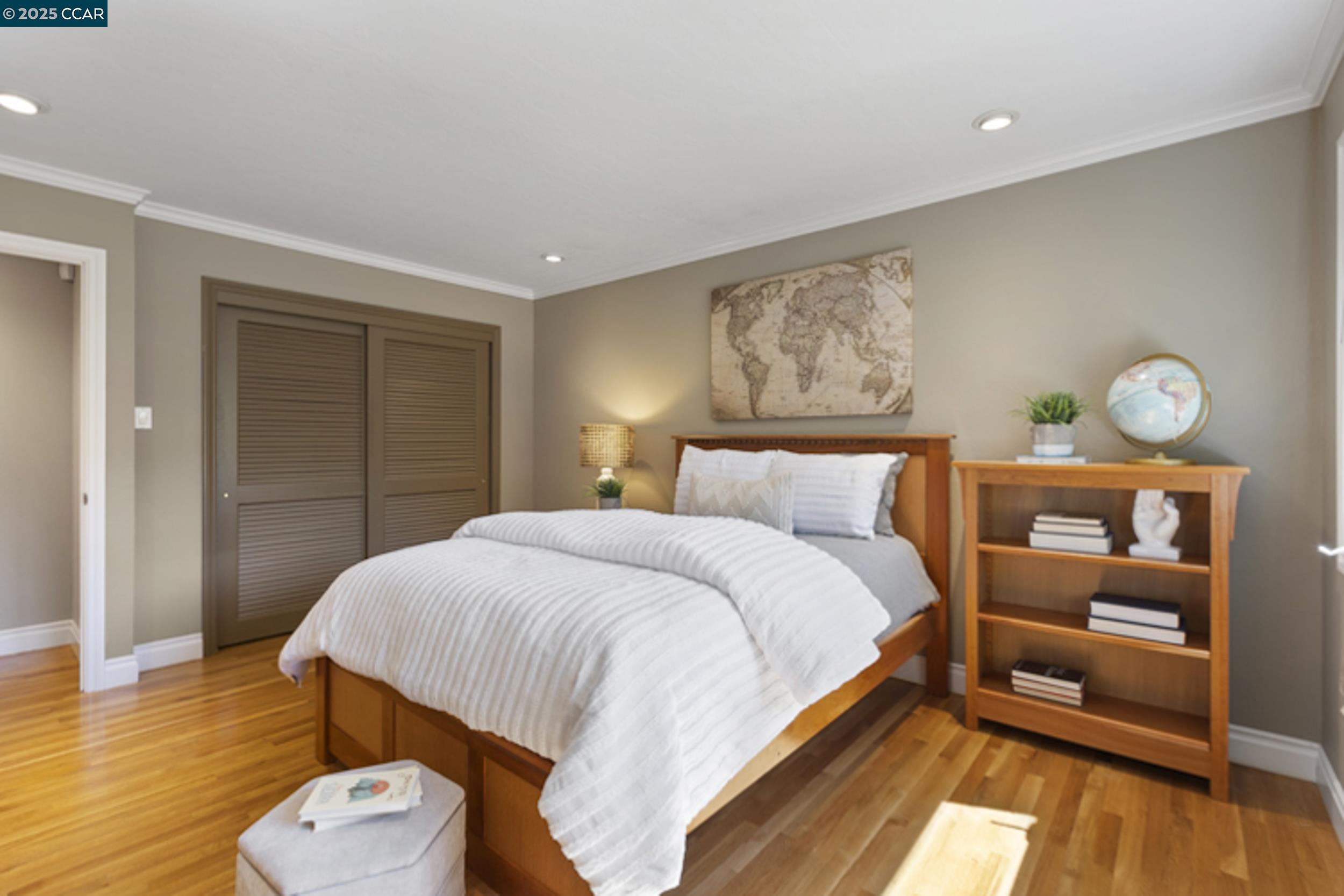 350 Pine Creek Road Walnut Creek, CA 94598 - Photo 31 of 59 a bedroom with a bed and wooden floor