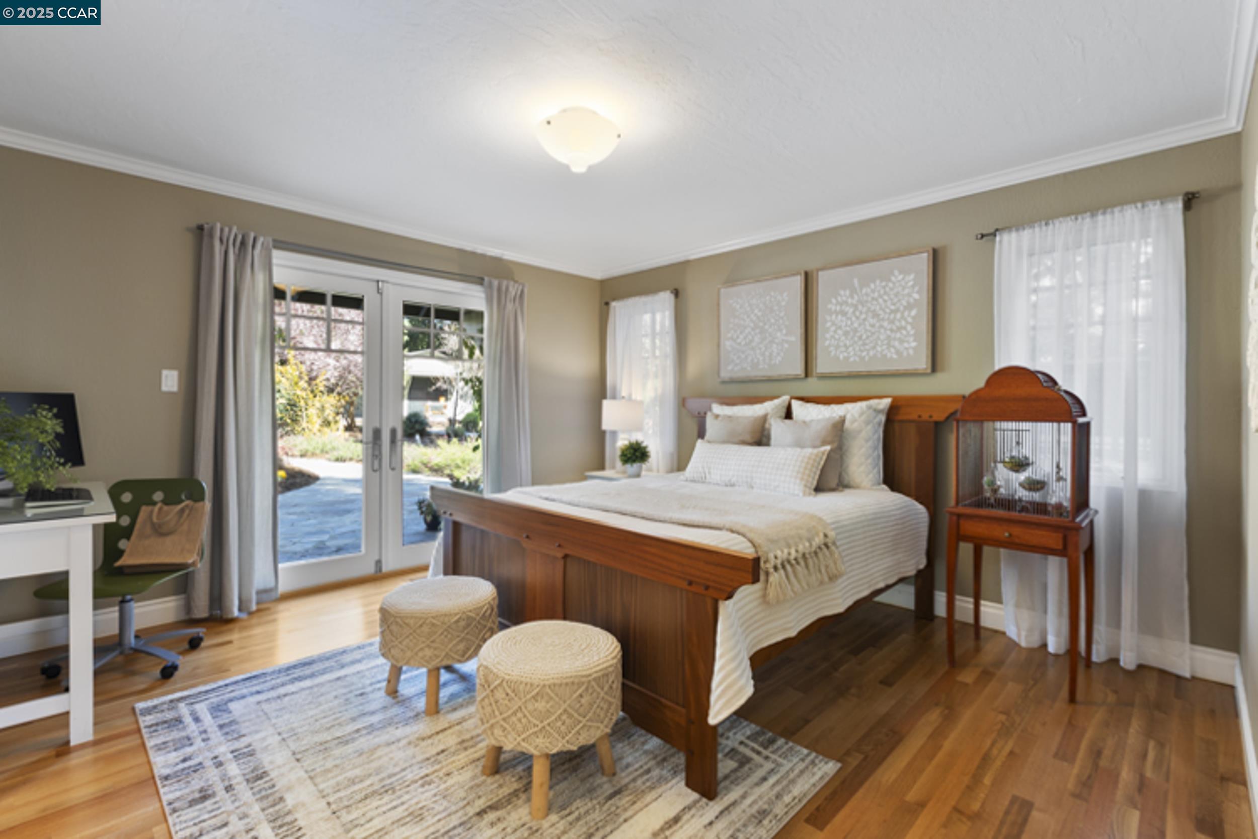 350 Pine Creek Road Walnut Creek, CA 94598 - Photo 32 of 59 a bedroom with a bed and wooden floor