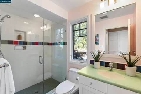 a room with sink and mirror