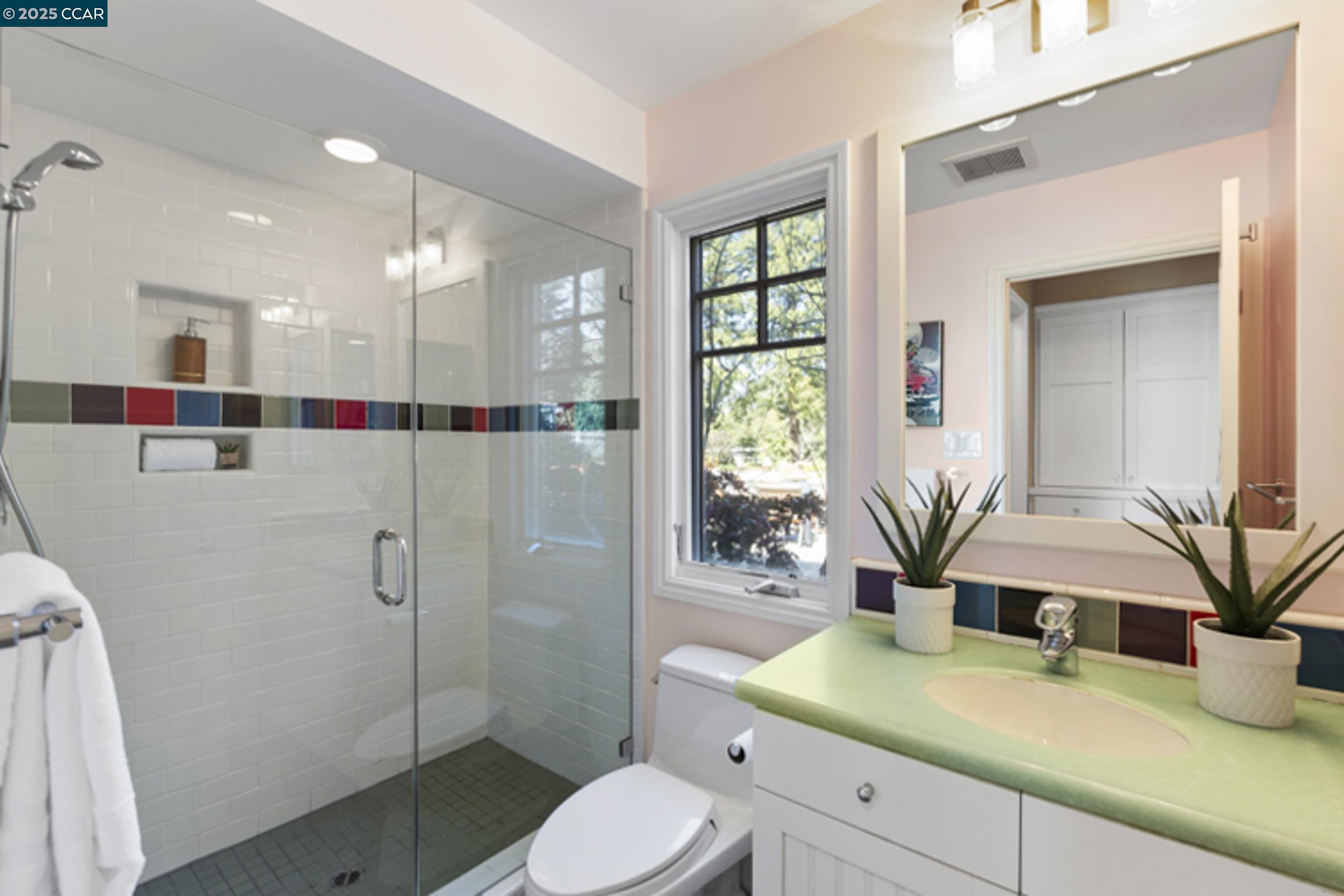 350 Pine Creek Road Walnut Creek, CA 94598 - Photo 34 of 59 a bathroom with a granite countertop sink mirror vanity and toilet