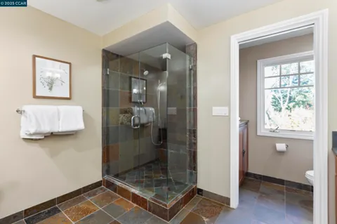 a view of a house with swimming pool and sitting area