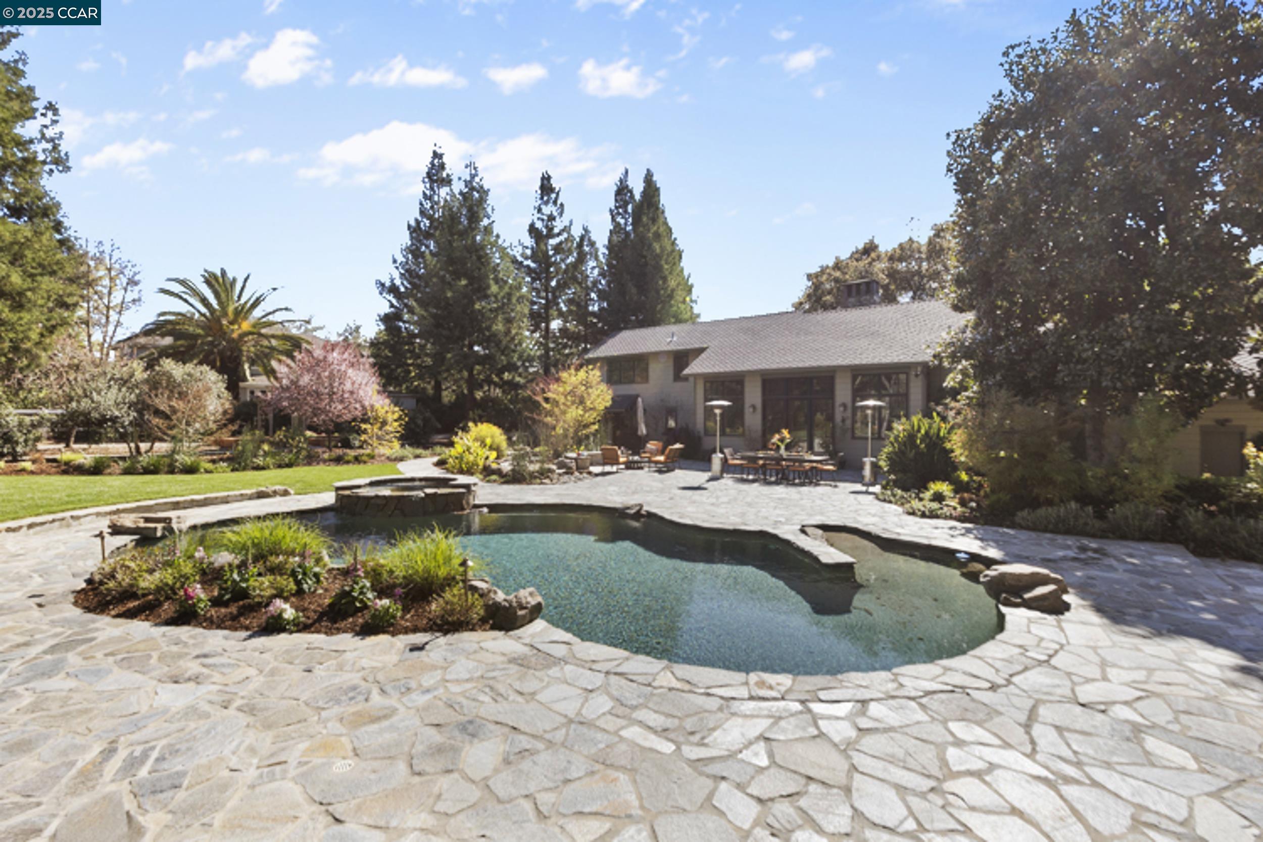 350 Pine Creek Road Walnut Creek, CA 94598 - Photo 37 of 59 a view of a house with swimming pool and sitting area