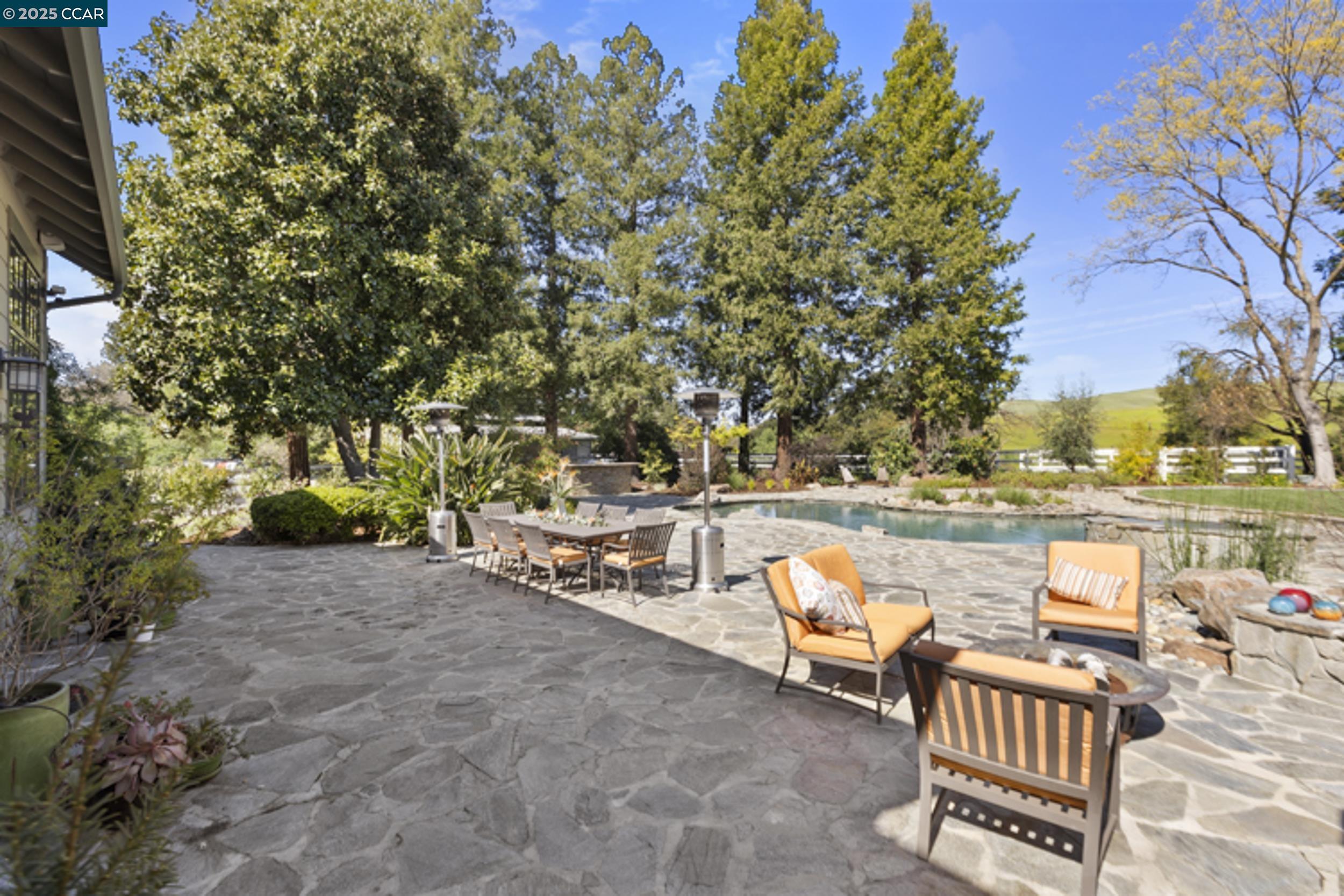 350 Pine Creek Road Walnut Creek, CA 94598 - Photo 39 of 59 a view of swimming pool with outdoor seating and plants
