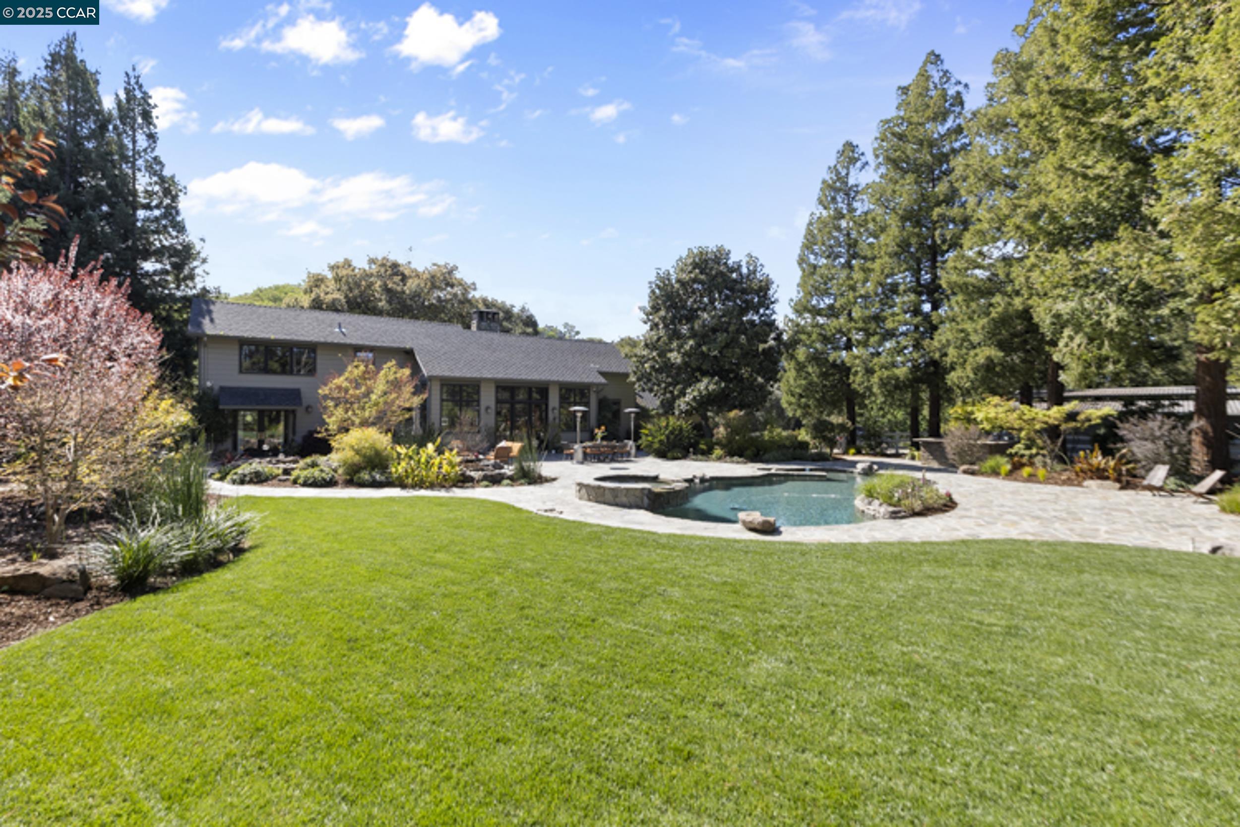 350 Pine Creek Road Walnut Creek, CA 94598 - Photo 41 of 59 a view of swimming pool with outdoor seating and garden